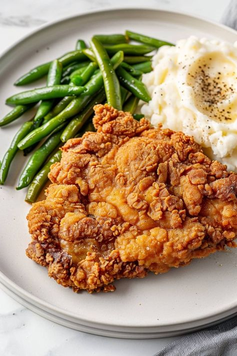 Chicken fried steak is an old-fashioned classic that never goes out of style! The crispy batter turns ordinary steak into a truly indulgent experience. Homestyle Recipes, Chicken Fried Steak Recipe, Fried Meat, Chicken Batter, Beef Entrees, Fried Steak Recipes, Country Fried Steak, Potluck Ideas, Beef Dinners