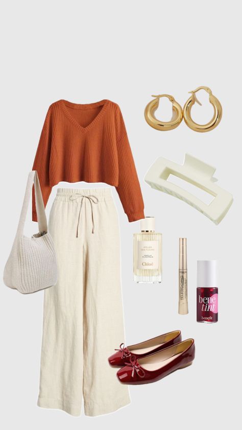 Get inspired with this cozy, chic fall outfit that embodies the perfect balance of comfort and style. Featuring a relaxed, burnt orange sweater paired with wide-leg linen pants, this look is ideal for those who love a laid-back yet polished aesthetic. The gold hoop earrings and knitted shoulder bag add a touch of understated elegance, while the red ballet flats provide a pop of color to elevate the ensemble. Whether you’re heading out for a casual brunch or a stroll through the park, this outfit offers a Soft Natural vibe with a dash of femininity.  #FallFashion #SoftNatural #KibbeTypes #EffortlessStyle #CasualChic #AutumnOutfitInspo #ComfortableYetChic #WideLegPants #CozyAndStylish #FashionForNaturals #MinimalMakeup #NaturalBeauty #PinterestFashion #RelaxedOutfit #FallWardrobeEssentials” Effortless Fall Outfits, Chic Fall Outfit, Red Ballet Flats, Burnt Orange Sweater, Fall Wardrobe Essentials, Orange Sweater, Orange Outfit, Chic Fall Outfits, Relaxed Outfit