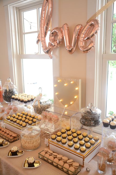 A rose gold dessert buffet for a wedding or bridal shower.  Mixed in with gold and peach to round out the color palette.   Design by Truly Scrumptious Candy & Dessert Bars #rosegoldwedding #rosegold #goldcolors #weddingcolors #desserts #dessertbuffet #love #bridalshowerdecor #weddingdecor Gold Candy Bar, Elegant Dessert Table, Pink Candy Bar, Gold Dessert Table, Baby Shower Buffet, Egg Party, Truly Scrumptious, Rose Gold Party Decor, Gold Dessert