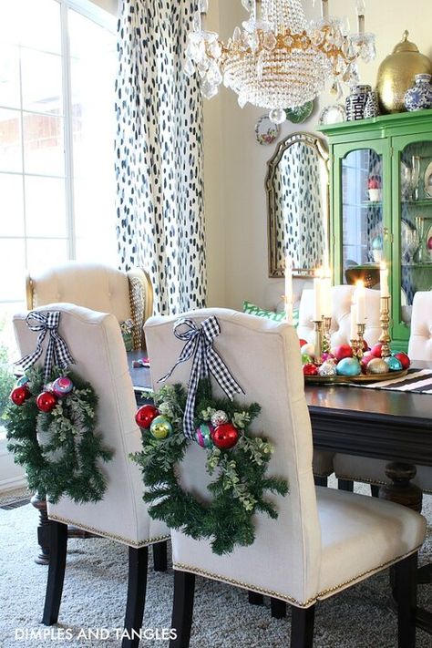 Decorating Chairs For Christmas, Chair Christmas Decorations, Christmas Dining Chair Decor, Wreaths On Back Of Chairs, Chair Wreaths Christmas Decor, Wreath On Chair Back, Wreaths On Chairs, Christmas Chair Decorations, Chair Wreaths