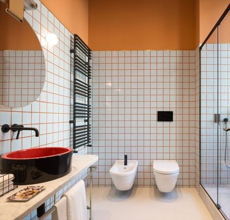 spruce up your bathroom with colorful grout like here with orange grout and orange half walls Bathroom Grout, Milan Hotel, Coloured Grout, Orange Bathrooms, Half Walls, Patricia Urquiola, Rustic Bathrooms, Bad Design, Bathroom Colors