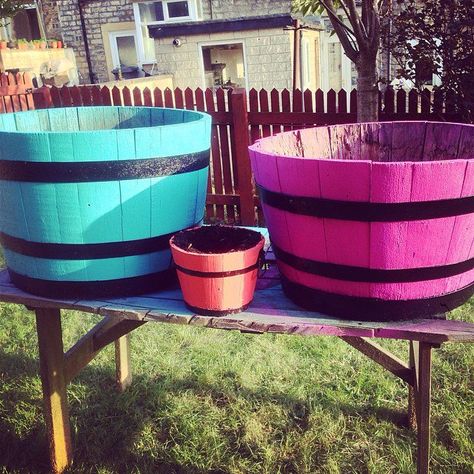 Pin for Later: 28 Easy Spray Paint DIYs That Spruce Up Your Space Bright Wood Barrels Painted Whiskey Barrel Planters, Painted Wine Barrels, Whiskey Barrel Planter, Barrel Flowers, Decorative Painting Techniques, Wine Barrel Planter, Barrel Planter, Wooden Barrel, Whiskey Barrel