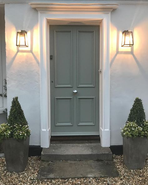 Claire on Instagram: “Just love our Calvi wall lights by @astrolighting. Lit up they are even more beautiful together with the beautiful timber panelled door…” Edwardian Villa, Farrow And Ball Pigeon, London Doors, 1930s House Exterior, House Frontage, Front Driveway, Hastings House, Victorian Front Doors, Cottage Front Doors