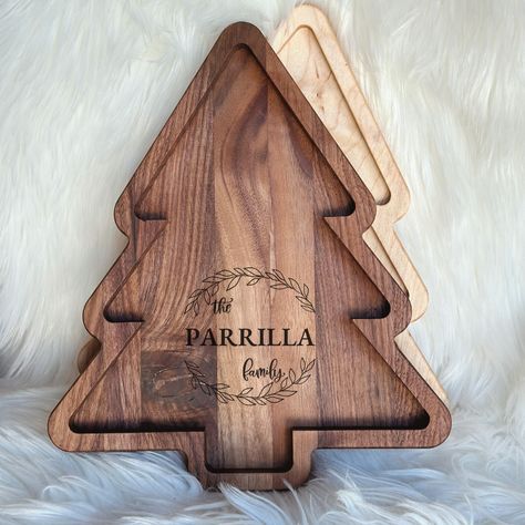 Elevate your holiday entertaining with our Handcrafted Personalized Wooden Tray / Charcuterie Board Tree. Create a personalized charcuterie experience that will delight your guests and be the centerpiece of your Christmas celebration! Before and after Christmas Eve, this board can be used as decoration and to actually serve food. The lip around the edge holds the food in place. These boards arrive sealed and ready to be used. The sealing of it makes the board food-safe and it easy to clean, howe Christmas Wood Boards, Laser Charcuterie Board, Christmas Cnc Projects, Cnc Christmas Projects, Charcuterie Board Christmas Tree, Wooden Christmas Gifts, Charcuterie Tree, Charcuterie Board Christmas, Christmas Tree Charcuterie