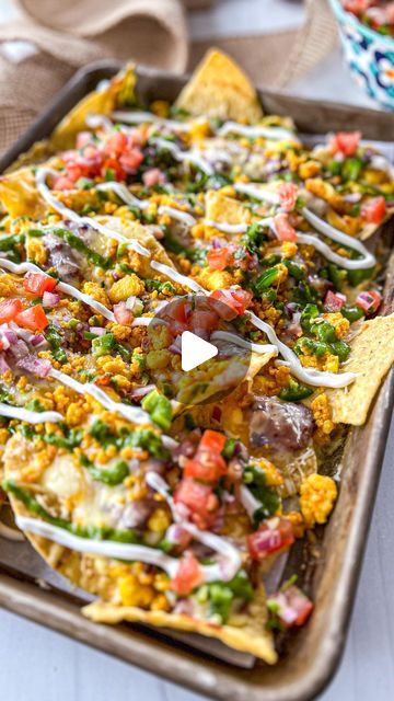 Pooja Jhunjhunwala on Instagram: "Paneer Nachos!! These are FIRE 🔥🧀
The recipe with all the instructions is on my website. Clickable LINK IN @theglobalvegetarian BIO 
OR go to www.theglobalvegetarian.com/recipes/paneer-nachos OR COMMENT *nacho recipe* OR *recipe* & ill DM YOU THE LINK!! 

Nachos are ALWAYS a good idea, like seriously who doesn’t like nachos?! This Paneer Nacho recipe is something everyone will LOVE! You’ve got crispy chips, refried beans, masala queso, more melted cheese, and chewy paneer all baked together and then topped with fresh salsa, the most addictive creamy chutney sauce, and sour cream. This Indian fusion recipe will win hearts!! 

Happy Cooking! 💗

#nachos #paneer #indianfood #cheese #fusionfood #vegetarian #theglobalvegetarian #vegetarianfood" Nacho Chips Recipe, Chutney Sauce, Nacho Recipe, Crispy Chips, Nacho Chips, Happy Cooking, Nachos Recipe, Fresh Salsa, Chips Recipe