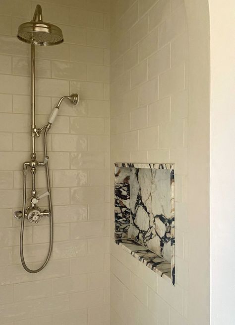 Shower wall ideas that are both practical and good-looking | Livingetc Shower Niche Marble, Stone Shower Niche, Shower Tile Ideas Walk In Master Modern, Bathroom Shower Shelves Built Ins, Shower Built In Storage, Tiled Shower Enclosure, Single Glass Shower Panel, Marble Bathroom Niche, Marble Wall Tile Bathroom