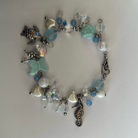 Ocean Charm Bracelet, Blue Charm Bracelet, Cluttered Bracelets, Bracelets Crochet, Tv Heads, Ocean Bracelet, Beaded Charm Bracelet, Frutiger Aero, Blue Charm