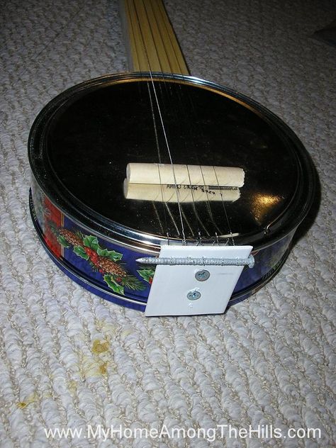 My homemade cookie tin banjo! Ukulele Diy, Kids Instruments, Homemade Musical Instruments, Banjo Music, Recycling Crafts, Homemade Cookie, Homemade Instruments, Resonator Guitar, Diy Instruments