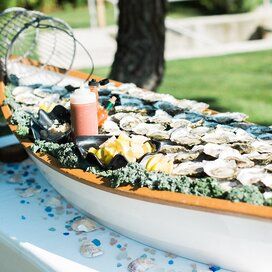 boat shaped serving tray filled with seafood Summer Wedding Menu, Cocktail Hour Food, Cookout Party, Welcome Dinner, Nautical Wedding Invitations, Raw Bar, Carnival Food, Oyster Crackers, Metallic Wedding