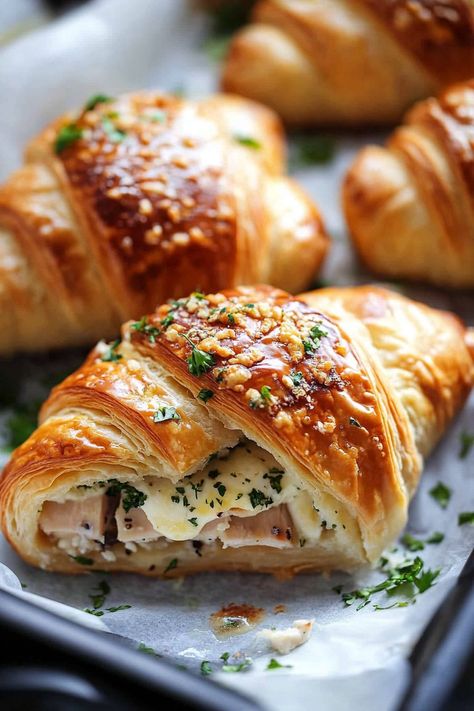 Discover the irresistible Buttery Garlic Baked Croissants with Turkey & Havarti. Perfect for brunch or a quick snack! Crossaint Blueberry Bake, Diy Crossant Recipes, Croissant Ring Recipe, Leftover Croissants Recipes, Crossaint Breakfast Sandwiches, Stuffed Croissants Breakfast, What To Make With Croissants, Croissants Recipe Stuffed, Croissant Recipe Stuffed