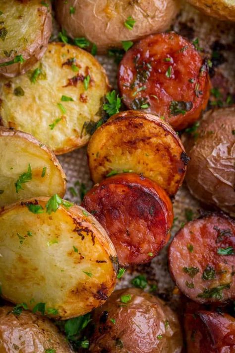 Roasted Potatoes and Kielbasa (One-Pan Recipe) - NatashasKitchen.com One Pan Kielbasa, Roasted Potatoes And Sausage, Sausage Recipes Potatoes, Potatoes And Kielbasa, Easy Kielbasa Recipes, Kilbasa Sausage Recipes, Kielbasa Sausage Recipes, Copycat Recipes Desserts, Potatoes And Sausage