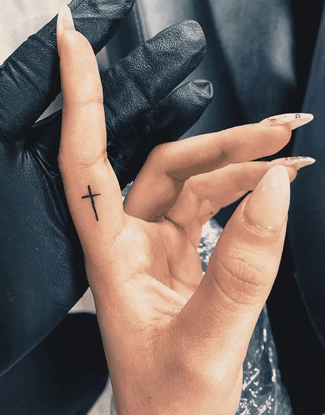 Small Cross With Butterfly Tattoo, White Ink Cross Tattoo, Minimal Cross Tattoo, Cross On Hand Tattoo, Cross On Finger Tattoo, Cross Tattoo On Finger, Heart And Cross Tattoo, Hand Cross Tattoo, Finger Cross Tattoo