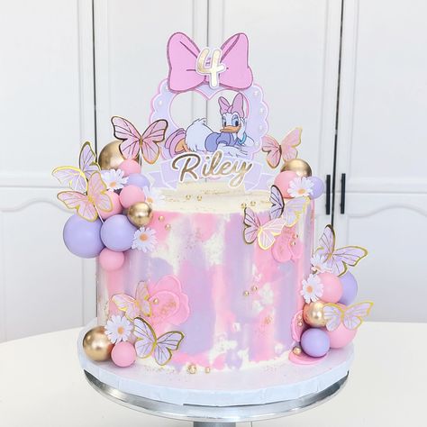 Pink and Purple Daisy Duck 8” Cake with Cake Balls and Butterflies Daisy And Butterfly Cake, Minnie Mouse Daisy Duck Cake, Minnie Mouse And Daisy Duck Cake, Purple Minnie Mouse Cake, Pink And Purple Butterfly Cake, Pink And Purple Cake Ideas, Butterfly Cake Design, Pink Butterfly Cake, Daisy Duck Cake