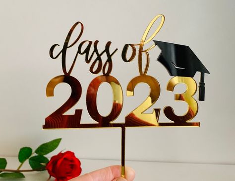 Personalized Class of 2023 cake topper. The gold glitter cake topper is cut out of wood and has a gold glitter PVC foil-faced finish. Please let me know if you would like to add a custom name or another custom text. Custom orders are welcome. We offer 2 different sizes (width): 6 inches 7 inches Color of the Cap: Black (please contact me if you would like a different color for the graduation cap). Color of the cake topper: picture #2 Materials: wood, acrylic, gold glitter foil See other items li 2023 Cake Topper, Graduation Cap Pictures, Congrats Cake Topper, 2024 Cake, Congrats Cake, 2023 Cake, Gold Glitter Cake Topper, Gold Cake Topper, We Bare Bears Wallpapers