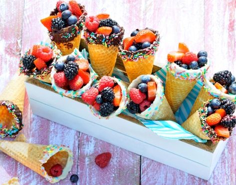 Waffle cones dipped in chocolate and filled with fresh fruit like strawberries, raspberries, and blackberries make this a wholesome and delicious treat. Chocolate Dipped Strawberries Valentines, Fruit Ice Cream Cones, Homemade Ice Cream Cones, Chocolate Strawberries Recipe, Cone Recipes, Homemade Ice Cream Cone, Ice Cream Cones Recipe, Dipped Fruit, Fruit Cones