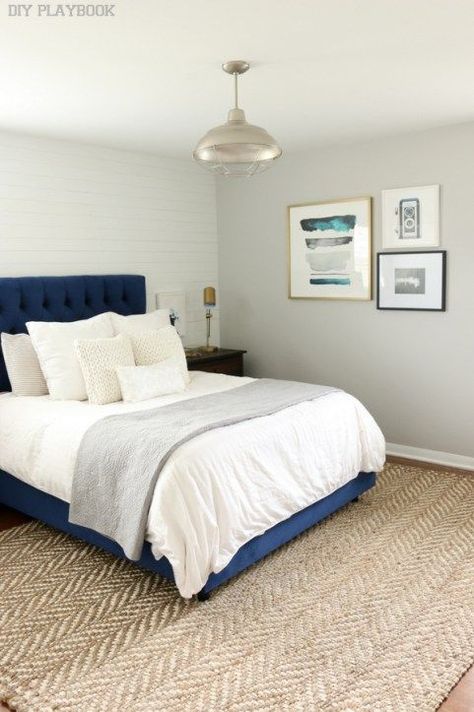 Lovely gallery wall in a quaint bedroom with an upholstered navy bed Navy Headboard, Blue Headboard, Gallery Wall Bedroom, Blue Rugs, White Headboard, Ideas Hogar, Bedroom Color Schemes, Design Master, Trendy Bedroom