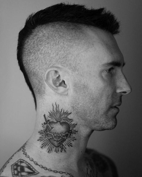 Timeless sacred heart tattoo on Adam Levine's right side of the neck.. Heart Tattoo On Neck, Adam Levine Tattoos, Sacred Heart Tattoo, Tattoo On Neck, Clavicle Tattoo, Sacred Heart Art, Sacred Heart Tattoos, Timeless Tattoo, Epic Tattoo