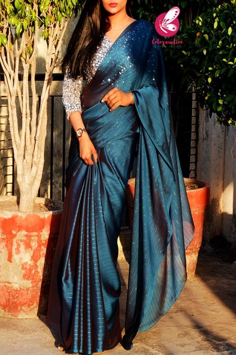 Teal Satin Saree, Blouse Ideas For Satin Saree, Teal Blue Blouse Designs, Satin Sarees With Designer Blouses, Designer Georgette Sarees Party Wear, Silver Blouses For Saree, New Designer Saree, Georgette Saree Draping Styles, Blue Farewell Saree