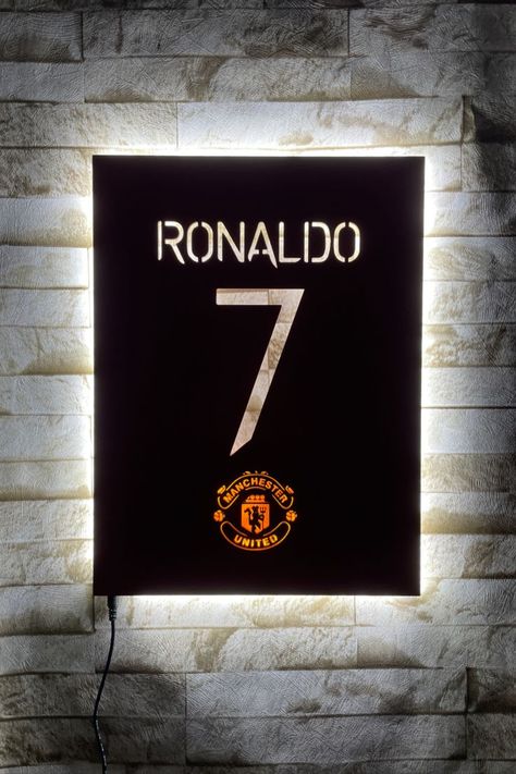 Cristiano Ronaldo wall decor will brighten your living room. You can use it as a night light. Manchester United Wall Art for Football Fan Gift. 👉 A workshop where your dream designs are produced; https://www.etsy.com/shop/MeerkatWoodDesign?ref=seller-platform-mcnav ✔️ Wooden led signs will act as a night light in your room thanks to the light they emit. ✔️ These wonderful wooden decors; Perfect for the living room, game room, office, kids room, garage and any entertainment area! ✔ Manchester United Gifts, Football Wall Decor, Football Room Decor, Laser Cut Lamps, Football Rooms, Living Room Game Room, Travis Scott Wallpapers, Art Football, Football Decorations