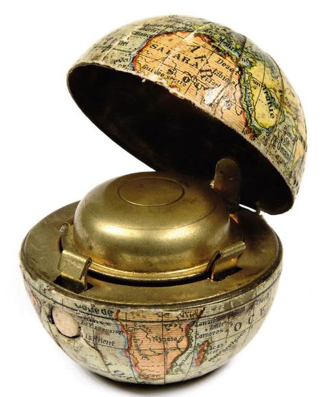 FRENCH GLOBE-INKWELL  EARLY 20TH CENTURY  24 half-gores mounted onto metal hemispheres, with the Antartic indented to sit flat, tropics shown, the Continents, some cities and countries given, opening at the equator to expose a small inkwell. 1¾in. (5cm.) high Antique Globe, Antique Inkwells, Desk Sets, Vintage Writing, Quill Pen, World Globes, Lettering Art, Pen Pals, Writing Accessories