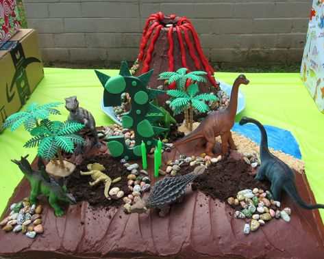 Dinosaur party cake rice crispies volcano diy Volcano Birthday Cake, Volcano Birthday, Dinosaur Volcano, Volcano Cake, Homemade Rice Krispies Treats, Peanuts Birthday, Monster Truck Cake, Dino Cake, Dinosaur Birthday Cakes