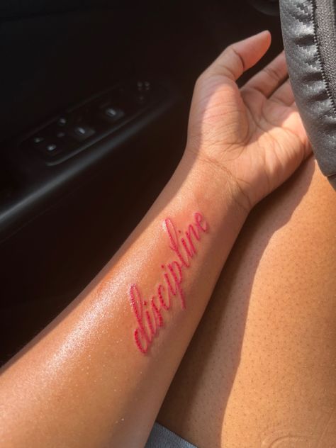 Red Ink Lettering Tattoo, Red Tattoo Designs For Women, Red Ink Wrist Tattoo, Red Tattoos For Men, Healed Red Ink Tattoo, Red Font Tattoo, Red Tattoos Aesthetic, Red Inner Arm Tattoo, 1 Of 1 Tattoo Red Ink