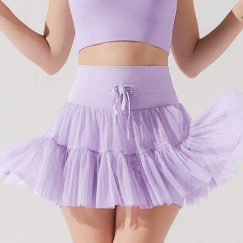 13 surprisingly affordable things Taylor Swift has worn recently and where to buy them Popflex Pirouette Skort, Lilac Short Skirt, Pop Flex Active, Pirouette Skort, Athletic Skirt Outfit, Digital Lavender, Cassey Ho, Lilac Top, Short Bra