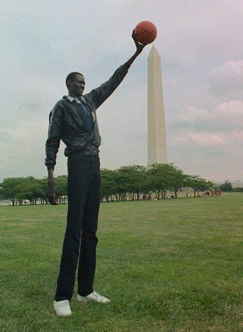 Meet the tallest people in Africa, the Dinka tribe (Jieeng) | The African History Manute Bol, Man Hug, Basketball Players Nba, South Sudan, Tall People, Sports Figures, A Basketball, African History, World Of Sports