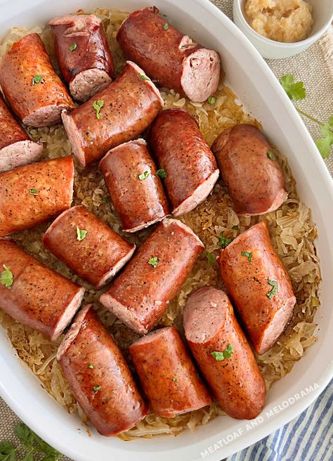 Grandma's Kielbasa and Sauerkraut recipe is an easy dinner made with smoked sausage and seasoned sauerkraut baked until hot and delicious. Your whole family will love this budget friendly meal, and it's easy enough for busy weeknights! Keilbasa And Sauerkraut, Smoked Sausage And Sauerkraut Recipe, Recipes With Sausage Links, Easy Kielbasa Recipes, Kielbasa And Sauerkraut, Dogs Recipes, Sausage Sauerkraut, Sauerkraut Recipe, Smoked Sausage Recipes