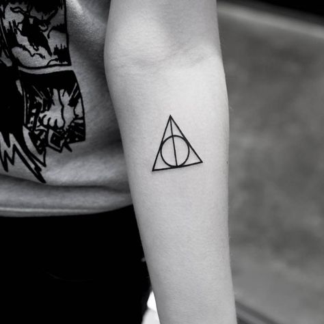 Deathly hallows symbol tattoo on the left inner forearm. Small First Tattoos, Hallows Tattoo, Minimalist Tattoo Meaning, Deathly Hallows Symbol, Potter Tattoo, Symbol Tattoo, Harry Potter Tattoos, Harry Potter Tattoo, Symbol Tattoos