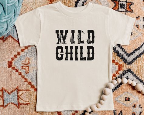 Wild Child Short Sleeve T-Shirt | Desert Shirt | Cactus, Mountain, Western, Wild West Theme Tee | Gift for Boy, Girl | Toddler, Youth, Kid by EvergreenKidsCo on Etsy Toddler Graphic Tee, Kids Tee Shirts, Retro Kids, Boys Graphic Tee, Girls Graphic Tee, Kids Graphic Tees, Boy Tees, Jesus Shirts, Kids Shorts