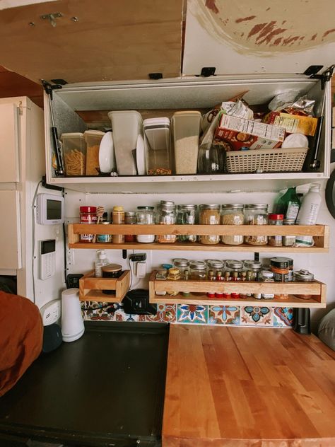 This blog post showcases what organization we use for our kitchen in our self converted campervan #vanlife #campervan Van Life Kitchen Storage, Van Shelf Storage, Vanlife Kitchen Storage, Van Organisation Ideas, Campervan Kitchen Storage Ideas, Campervan Kitchen Storage, Camper Van Cabinets, Campervan Shelves, Van Kitchen Storage