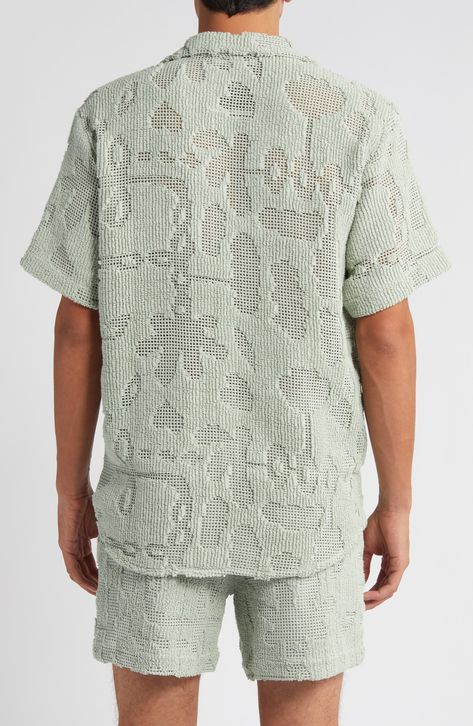 An abstract take on botanical motifs is brought to life in the cotton-blend crochet of this camp shirt in an eased-up, relaxed fit. 30" length; 43" chest (size Medium) Front button closure Notched collar Short sleeves 90% cotton, 10% polyester Machine wash, line dry Made in Portugal Mens Summer Knitwear, Botanical Motifs, Spring Wardrobe Essentials, Smart Casual Menswear, Textures Fashion, Summer Yarn, Knit Structure, Boys Knits, Guy Laroche