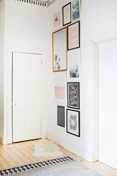 wall behind the entry door Wall Between Two Doors, Vertical Gallery Wall, Tuscan Wall Decor, Hallway Wall Decor Ideas, Fixer Upper Living Room, Hallway Gallery, Hallway Gallery Wall, Hallway Walls, Staircase Decor