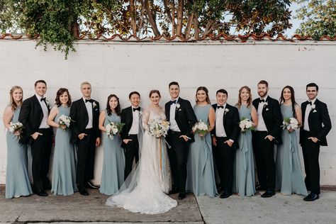 These blue bridesmaids dresses and black tuxedos were so chic in the bridal party photos from this Darlington House wedding. #bridalparty #bridalpartyphotos #darlingtonhouse Dusty Blue Wedding With Black Suits, Dusty Blue And Black Wedding Party, Black Suits Blue Dresses Wedding, Black Tuxedo Wedding Party, Dusty Blue Black Wedding, Different Blues Bridal Party, Dusty Blue Bridesmaid Dresses And Black Suits, Black And Dusty Blue Wedding, Dusty Blue Bridesmaid Dresses Black Suits