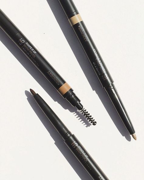 Get brow-raising results with our Shape It Up Brow Pencil. Our long wearing, smudge-proof pencils contain larch & green tea complex to help brows looks fuller. Eyebrow Product Photography, Eyebrow Pencil Photography, Brow Pencil Photography, Arbonne Makeup, Brow Products, Cosmetic Creative, Threading Eyebrows, Cosmetics Photography, Beauty Products Photography