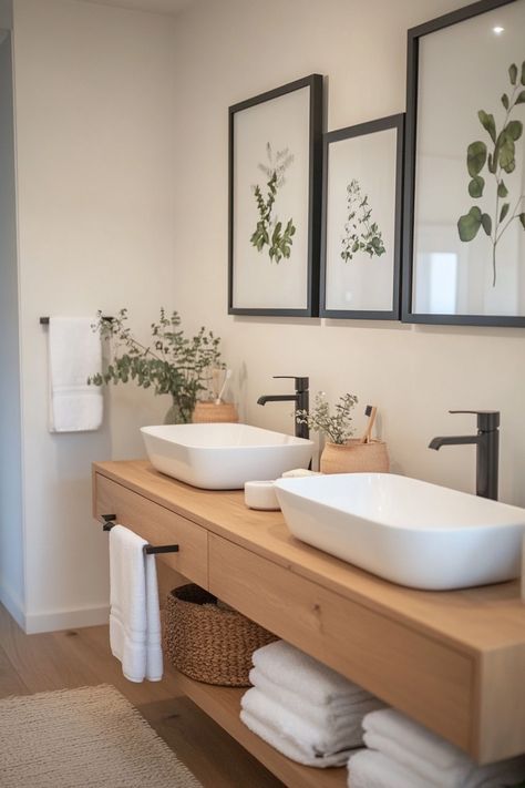 Modern bathroom with dual sinks, wooden vanity, and botanical artwork. Spa Like Powder Room Ideas, Modern Organic Powder Room, Spa Bathroom Vanity, Organic Modern Powder Room, Modern Half Bathroom Ideas, Modern Half Bathroom, Modern Organic Bathroom, Powder Room Redo, Organic Bathroom