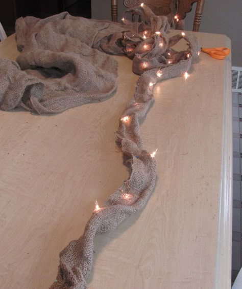 String Christmas lights in burlap. Rustic and fancy at the same time. Homemade Garland, Fire Mantel, Burlap Lights, Lighted Garland, Pole Wrap, Night Lite, Burlap Garland, Garland Ideas, Burlap Decor