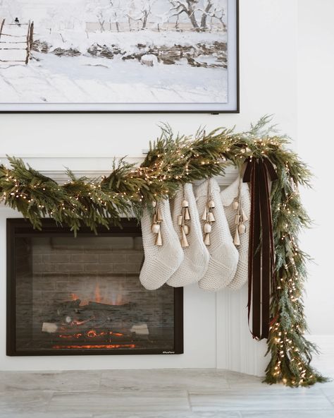 A few stills of the fireplace 🤎 Read Below for everything you need to create this look 🌲 . Comment SHOP below to receive a DM with the link to shop this post 🔗 . What I used: Lights: 1 - 42.6FT - 500 LED Amazon Garland: 2 Tjmaxx Garland: 2 Hooks: 4 Stocking Holders: 4 Stockings: 4 Bells: 4 Ribbon: velvet Brown, silk brown & velvet Burgundy . . Fireplace Christmas Decor - DIY Christmas Garland with lights — christmas lights for Mantel - Christmas Stockings - Christmas Bells - Christmas Ribbon ... Brown Velvet Ribbon Christmas, Garland And Stockings On Mantle, Garland On Fireplace Mantels, How To Hang Stockings On Mantel, Burgundy Fireplace, No Mantle Stocking Idea, Where To Hang Stocking With No Fireplace, Fireplace Christmas Decor, Christmas Garland With Lights