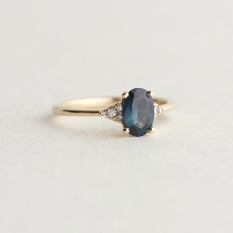 Teal Sapphire Oval Engagement Ring | Juniper Ring | Evorden Alternative To Diamond Engagement Rings, Teal Engagement Rings, Coloured Wedding Rings, Blue Topaz Oval Ring, Dark Stone Engagement Ring, Blue Rings Engagement, Unique Engagement Rings Simple, Simple Vintage Engagement Rings, Sapphire Oval Engagement Ring