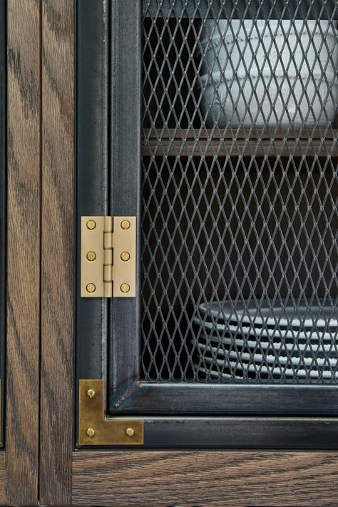 Close up shot of steel tube & mesh kitchen wall cabinet doors with brass hinges & detailing Brass Wire Mesh Cabinet Doors, Industrial Bar Cabinet, Industrial Cabinet Design, Metal Mesh Cabinet Doors, Industrial Kitchen Cabinets, Wire Mesh Cabinet Doors, Steel Mesh Door, Hetherington Newman, Metal Mesh Cabinet