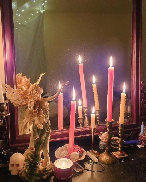 Several pink candles are lit next to a mirror and fairy statue. Light Witchy Aesthetic, Fairy Alter, Pink Altar Aesthetic, Pink Magic Aesthetic, Alter Aesthetic, Pink Candle Magic, Pink Witch Aesthetic, Fairy Altar, Practical Magic Aesthetic