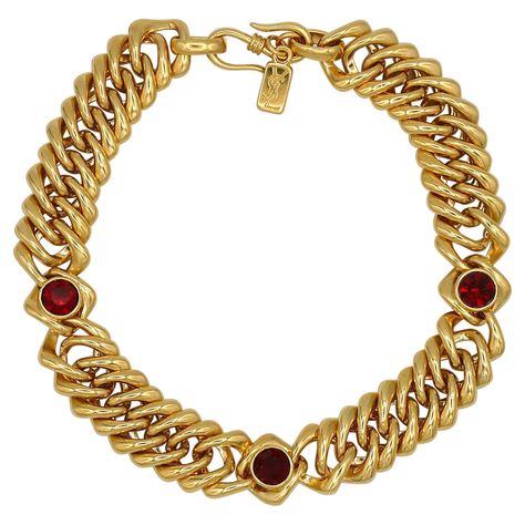 YVES SAINT LAURENT vintage iconic gold toned curb chain necklace embellished with three ruby red crystals. Hook clasp closure. Embossed YSL Made in France. Indicative measurements : length approx. 38 cm (14.96 inches) / width approx. 2.2 cm (0.87 inch). NOTES - This is a preloved vintage item, therefore it might have imperfections. - Colors may differ slightly from actual product appearance due to differences in lighting conditions. - As a buyer, you are fully responsible for customs duties, other local taxes and any administrative procedures related to imports into the country of destination. Ysl Necklace Gold, Ysl Necklace, Ysl Vintage, Saint Laurent Vintage, Curb Chain Necklace, Red Necklace, Jewelry Lookbook, Cross Bracelet, Hook Clasp