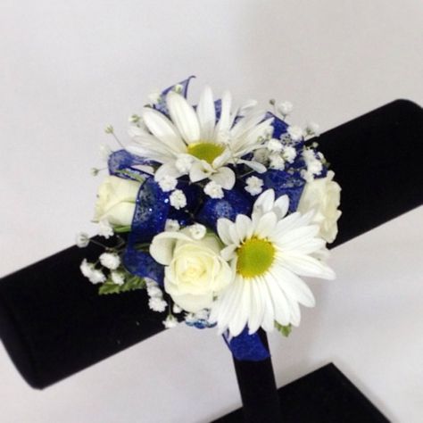 Wrist corsage of pretty white daisies & white spray roses with a sparkly royal blue bow. Wrist Corsage Royal Blue, Daisy Corsage, Prom Committee, Ffa Banquet, Wristlet Corsage, 50th Wedding Anniversary Cakes, Prom Corsages, Prom Corsage And Boutonniere, Wrist Corsage Prom