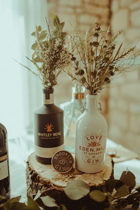 Spirit Bottle Centrepiece, Liquor Bottle Wedding Centerpieces, Gin Bottle Centrepiece, Foliage Centrepiece, Bottle Centerpieces Wedding, Wedding Centre Piece Ideas, Bottle Centrepiece, Centrepiece Ideas, Wedding Centrepiece