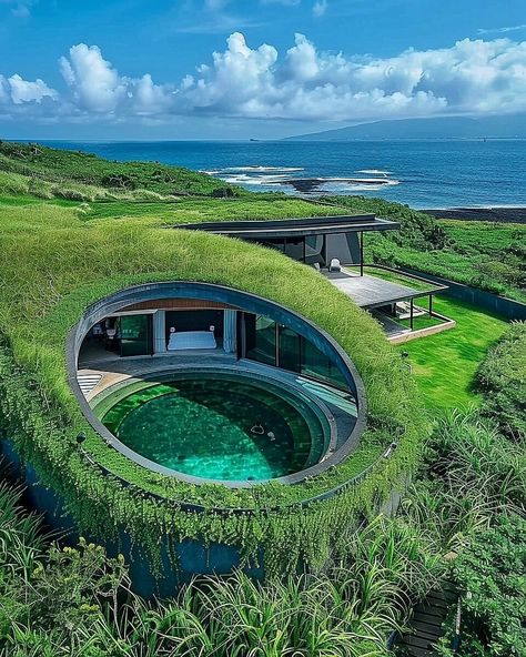 Jima House represents a paradigm shift in contemporary architectural discourse, marrying advanced design principles with a profound respect for the natural environment. Situated atop the rugged cliffs of Iwo Jima, this conceptual residence embodies the ethos of organic architecture, redefining spatial relationships and materiality. #architecture #house #interiordesigner #decor #diy #homedecor #amazingarchitecture #interiordesign #contemporaryhome #modern #residence #designer #home #garden Biotecture Architecture, Earth Integrated House, Earthship Home Exterior, Modern House In Nature, Organic Modern Architecture, Materiality Architecture, Eco Friendly House Architecture, Solarpunk Architecture, Iceland Architecture