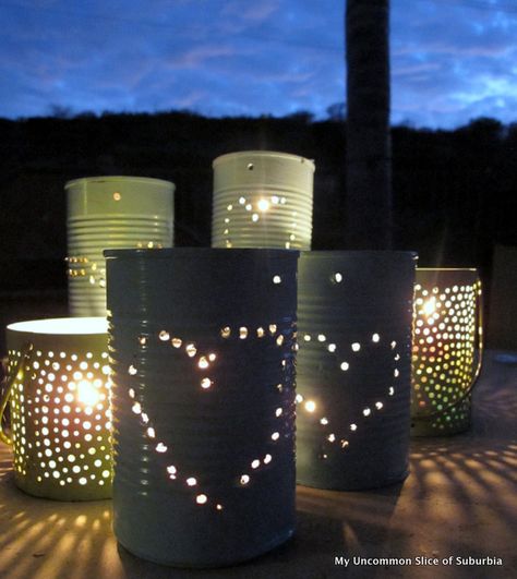 DIY Tin Can Lanterns {This is a cute, easy and very inexpensive way to make seasonal luminaries for your yard, porch or sidewalk. Use flameless tealights for safety ~S} Making Lanterns, Upcycling Crafts, Can Lanterns, Tin Crafts, Tin Can Lanterns, Tin Anniversary, Recycled Tin Cans, Barn Dance, Punched Tin