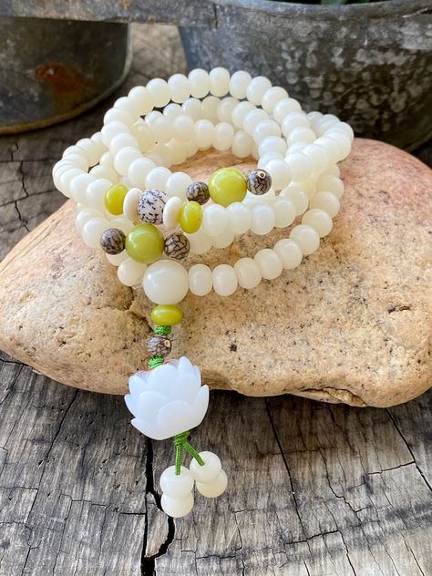 Excited to share this item from my #etsy shop: Lotus Bracelet, Womens Bracelet, Beaded Bracelet, White Bodhi Seed Olive Nut Bracelet, Rosary Prayer Meditation Yoga Bracelet Bracelet Rosary, Nut Bracelet, Lotus Bracelet, Mala Beads Bracelet, Womens Bracelet, Rosary Prayer, Hippie Decor, Yoga Bracelet, Meditation Yoga