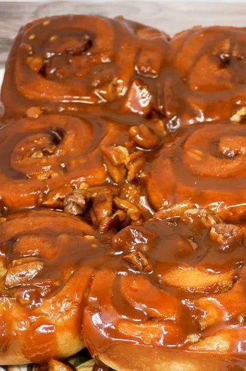 Sticky Puppies are caramel pecan sticky buns that are made with frozen cinnamon rolls and homemade buttery caramel sauce. By using quick-rise rolls, you can make these delicious Caramel Cinnamon Rolls in about 30 minutes. Time to eat! | Caramel Pecan Cinnamon Rolls | butterscotch cinnamon rolls | butterscotch pudding rolls | caramel sticky rolls | Caramel Cinnamon Rolls | Caramel Breakfast Rolls | #breakfast #brunch #sweets #caramel #cinnamonrolls Best Caramel Rolls Recipe, Pecan Cinnamon Rolls Recipe, Frozen Cinnamon Rolls, Caramel Pecan Cinnamon Rolls, Maple Bacon Cinnamon Rolls, Caramel Cinnamon Rolls, Caramel Pecan Sticky Buns, Pilsbury Recipes, Easy Sticky Buns