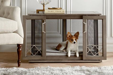 If you’ve ever lived with a dog that needed to be crated, you totally understand how awful it is to live with a giant cage in your home. It sticks out (because when is it ever normal to have a cage in a room?). It somehow always looks messy. And your pup usually looks woefully sad when he's inside the metal contraption. To be fair, crates can be quite beneficial for some dogs. A lot of dogs enjoy it and find comfort in being crated. It's just the whole cage thing. Optics, you know? Decorative Dog Crates, Kennel Furniture, Furniture Style Dog Crate, Crate End Tables, Diy Dog Crate, Wooden Dog Crate, Wooden Dog House, Dog Crates, Dog Crate Furniture